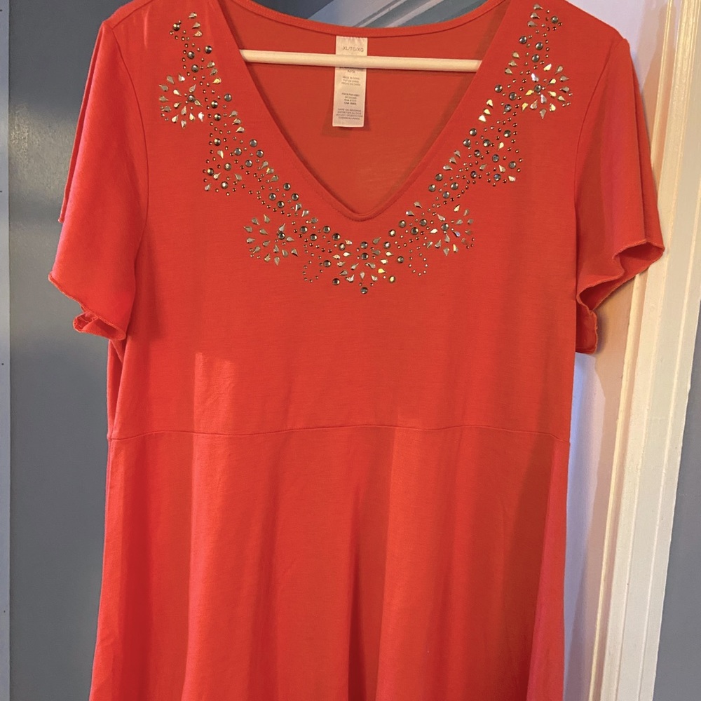 Orange plus size top with detail around neck
